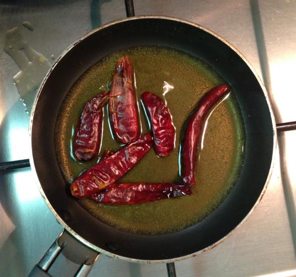 Dry chillis in the pan with ghee