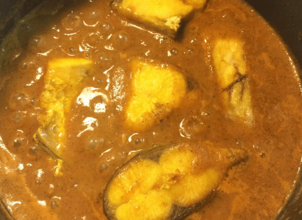 Add fish pieces to curry