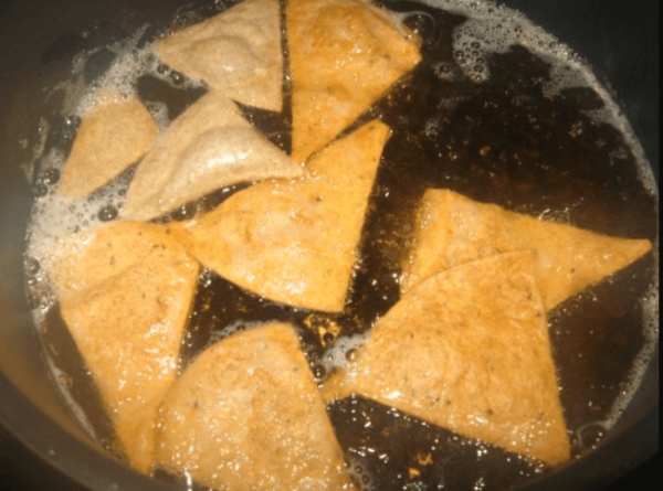 Deep fry tortiolla chips in hot oil