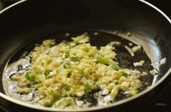 Add ginger garlic & spring onions to wok